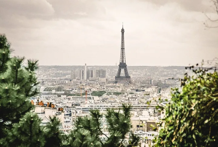 Paris skyline with the Eiffel Tower above the city roofs